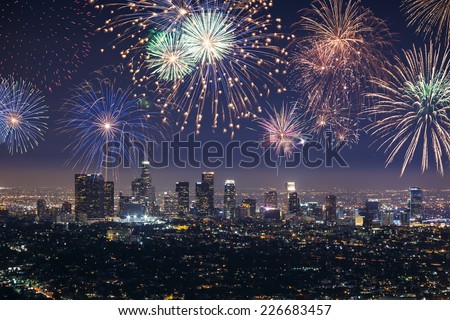 Downtown Los angeles cityscape with flashing fireworks celebrating New Year's Eve. Royalty-Free Stock Photo #226683457