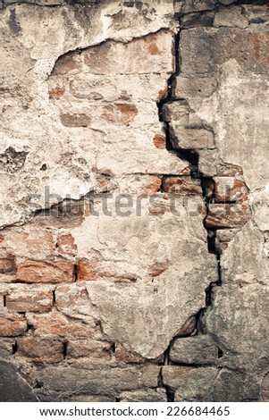 Old damaged wall with a big crack texture