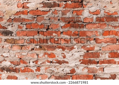 Old red brick wall texture with cement close up. Grunge background. Can be used in interior design