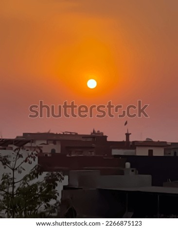 The sun is setting in Manga Mandi, a city in Pakistan