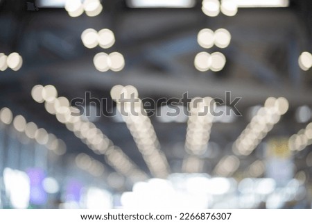 Blurred image of the ceiling with blurry lights.