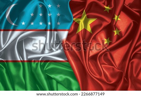 Uzbekistan and China two folded silk flags together