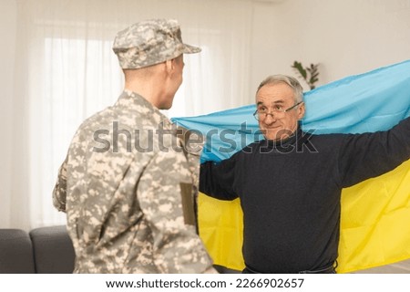 elderly father and son military flag of Ukraine