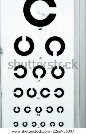 Landolt C broken ring optotypes or Japanese vision test in various sizes and orientations, an eye chart used for testing vision and visual acuity used by health care professionals, selective focus Royalty-Free Stock Photo #2266956007
