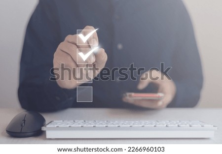 Businessman writing or making valid marks to approve documents and project ideas ,Concept Approval Agreement Royalty-Free Stock Photo #2266960103