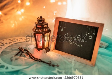 Ramadan Kareem Greeting image, colourful lantern with black board and Ramadan decoration 2023 Ramadan Mubarak and Eid al adha  concept image Royalty-Free Stock Photo #2266970881