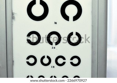 Landolt C broken ring optotypes or Japanese vision test in various sizes and orientations, an eye chart used for testing vision and visual acuity used by health care professionals, selective focus Royalty-Free Stock Photo #2266970927