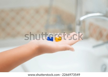 A picture of a young woman trying to put on contact lenses. High quality photo