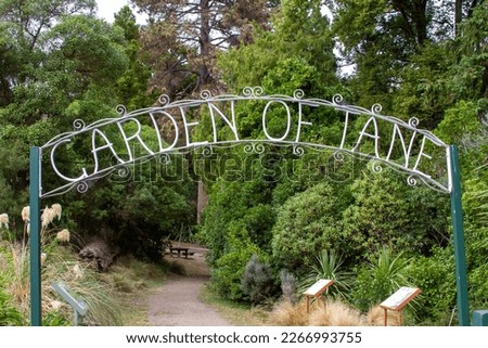 Entrance sign to the Garden of Tane in Akaroa, New Zealand.