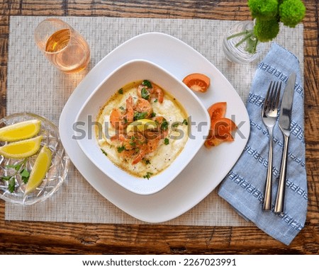 Rich flavors of the South creamy, buttery grits succulent shrimp and a flavorful broth. South Carolina style Southern hospitality, Southern food, nola food, New Orleans, Cajun Royalty-Free Stock Photo #2267023991
