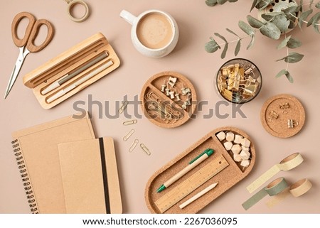 Flatlay of office supplies made of recycled materials on beige background. Flat lay, top view photo mock up. Royalty-Free Stock Photo #2267036095