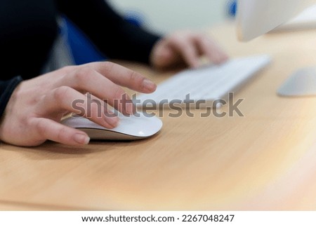 Close up shot of human woman hands using laptop computer, typing, writing, taking note