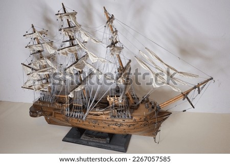 old sailing ship model made of wood with a white background Royalty-Free Stock Photo #2267057585