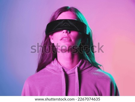 Vr, metaverse and woman in 3d virtual reality isolated on a background in studio. Futuristic neon, face technology and female with cyber glasses for online gaming, internet browsing or simulation.