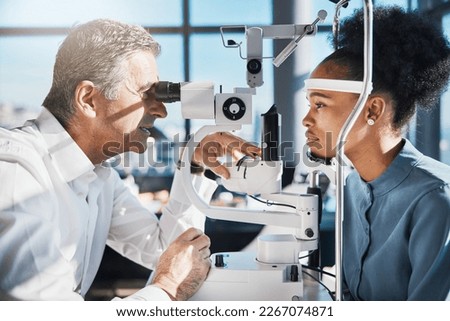 Test, eye exam or black woman consulting doctor for eyesight at optometrist or ophthalmologist. African customer testing vision with mature optician helping or checking iris or retina visual health Royalty-Free Stock Photo #2267074871