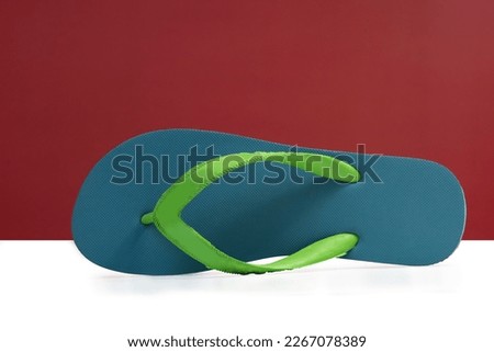 rubber slippers on a white red background, Suitable for wearing, using for various activities comfortably, easy to remove