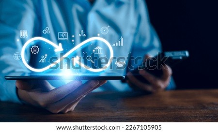 Technology infinity data link concept, Businessman Hands holding virtual infinity with technology marketing online icon for symbol of connection to community metaverse world network system concept.