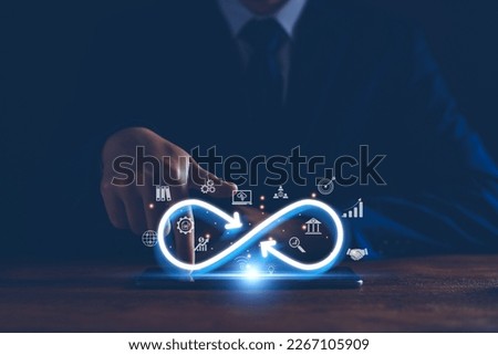 Technology infinity data link concept, Businessman Hands holding virtual infinity with technology marketing online icon for symbol of connection to community metaverse world network system concept. Royalty-Free Stock Photo #2267105909