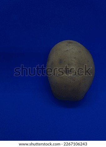 A picture of potatoes with a blue background