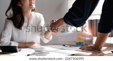 Business handshake for teamwork of business merger and acquisition,successful negotiate,hand shake,two businessman shake hand with partner to celebration partnership and business deal concept.. Royalty-Free Stock Photo #2267106595
