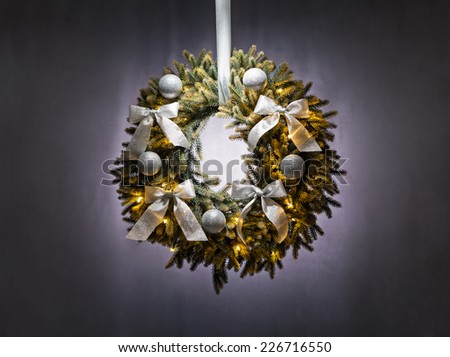 Advent wreath over silver grey background Christmas lights