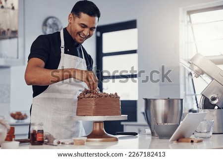 Chef, baking and cake with chocolate in a kitchen by a happy man preparing a sweet desert or a birthday. Decoration, baker or cook with a small business smiling and cooking dessert at a bakery Royalty-Free Stock Photo #2267182413