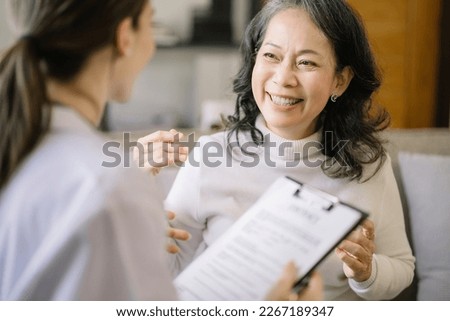 Concerned senior old patient patient talks with healthcare professional.