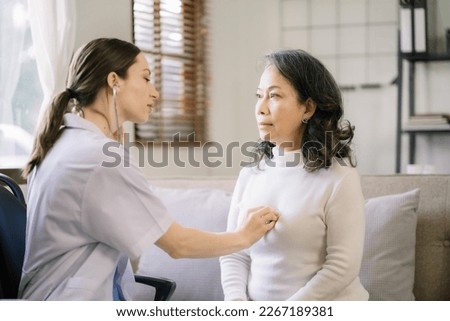 Doctor with stethoscope examining elderly patient with examination, presenting symptoms and recommending treatment, healthcare and medical concept.