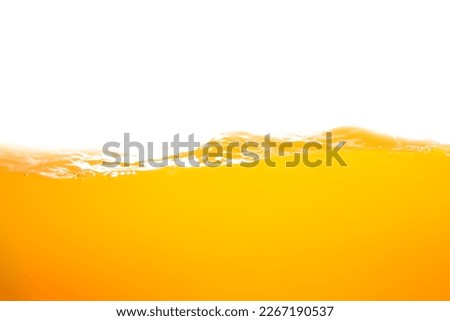 orange juice is isolated on white background. healthy fresh drink and natural waves. close up view. Royalty-Free Stock Photo #2267190537