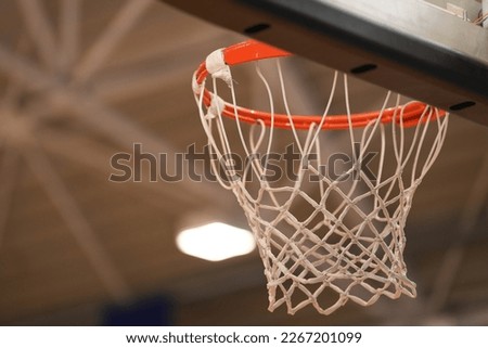 Basketball hoop close up in a school sport gym hall.