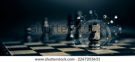Chess pieces and teamwork with graphic icons concepts of leadership or wining to challenge or battle fighting of business team player and strategy and risk management or human resource. Royalty-Free Stock Photo #2267203631