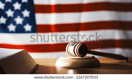 U.S. Supreme Court with gavel on a book and U.S. flag Royalty-Free Stock Photo #2267207033