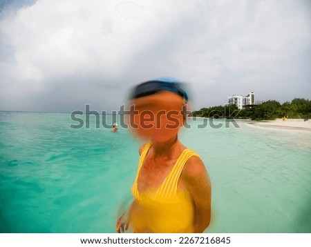 funny picture of woman face cover by water splash