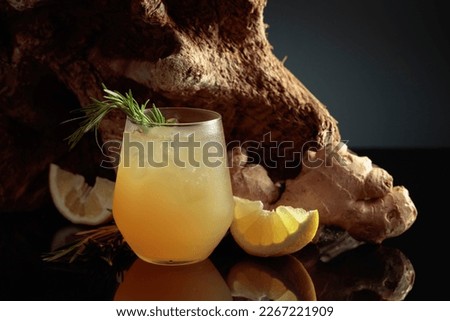 Ginger Ale or iced cocktail. Homemade lemon and ginger organic drink, copy space. Royalty-Free Stock Photo #2267221909