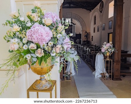 Vintage wedding decoration flower outside church in italian wedding with pink hydrangea