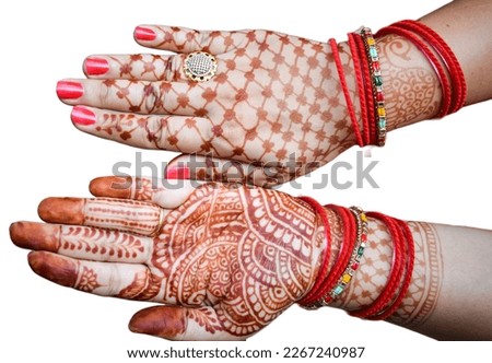 Beautiful woman dressed up as Indian tradition with henna mehndi design on her both hands to celebrate big festival of Karwa Chauth with plain white background