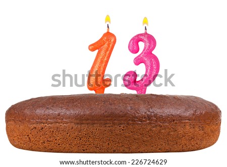 birthday cake with candles number 13 isolated on white background