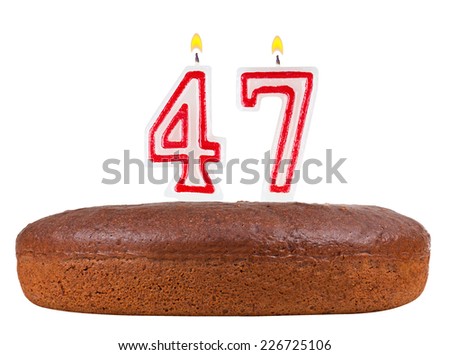 birthday cake with candles number 47 isolated on white background