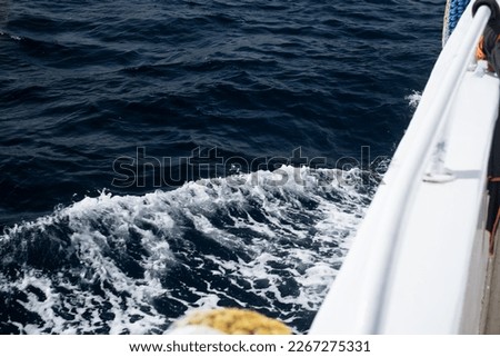 Path on the water behind the motor boat. Path on the water surface behind a fast moving motorboat