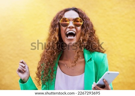 Smile, fashion and face of black woman with phone for social media, internet and 5g smartphone in city. Communication, wow success and portrait of excited, happy and girl winner on yellow background