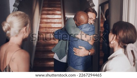 Hug, love and friends meeting at a reunion, home support and social celebration at a housewarming. Diversity welcome, affection greeting and men and women hosting a party to celebrate friendship