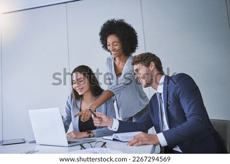 Working hard for the top results they strive for. Shot of a diverse group of businesspeople working together on a laptop in an office. Royalty-Free Stock Photo #2267294569