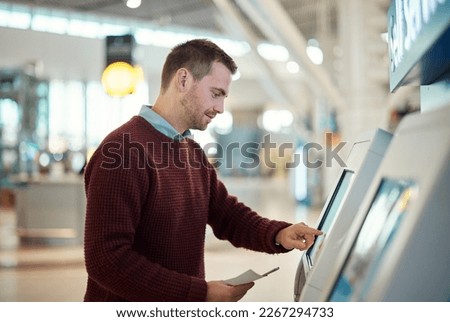 Man, airport and self service for check in, ticket registration or online boarding pass. Male traveler by terminal machine or kiosk for travel application, document or booking flight for plane trip Royalty-Free Stock Photo #2267294733