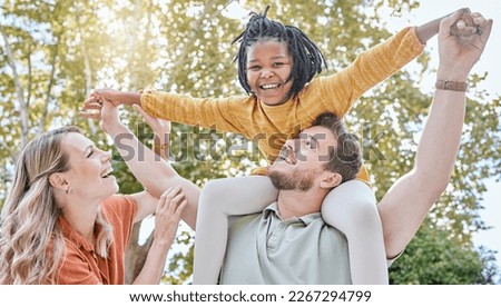 Family, adoption and piggyback in the park with a girl and foster parents having fun together in the park. Diversity, playful and freedom with a mother, father and daughter bonding outdoor in nature Royalty-Free Stock Photo #2267294799