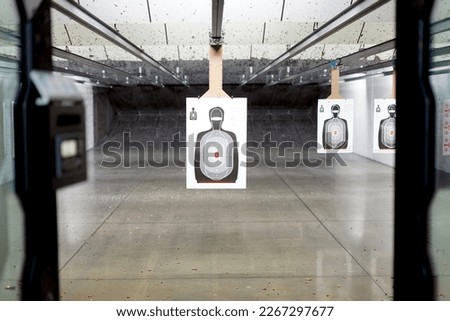 Shooting range POV, of paper silhouette target Royalty-Free Stock Photo #2267297677