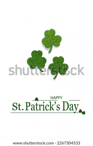 Happy St. Patrick's Day banner.Holiday background.St Patricks Day frame against a white background. Flat lay shamrocks.Copy space.Patrik's day banner Royalty-Free Stock Photo #2267304533