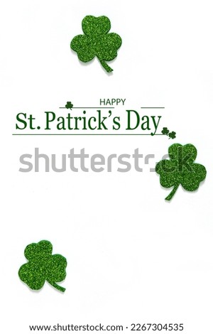Happy St. Patrick's Day banner.Holiday background.St Patricks Day frame against a white background. Flat lay shamrocks.Copy space.Patrik's day banner Royalty-Free Stock Photo #2267304535