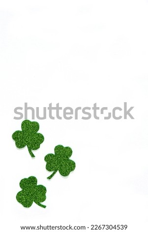 Happy St. Patrick's Day banner.Holiday background.St Patricks Day frame against a white background. Flat lay shamrocks.Copy space.Patrik's day banner Royalty-Free Stock Photo #2267304539
