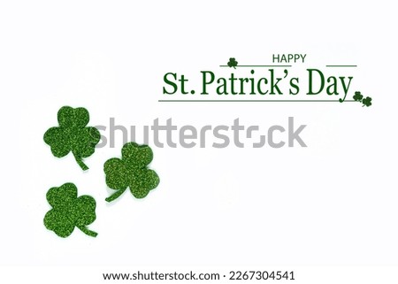 Happy St. Patrick's Day banner.Holiday background.St Patricks Day frame against a white background. Flat lay shamrocks.Copy space.Patrik's day banner Royalty-Free Stock Photo #2267304541