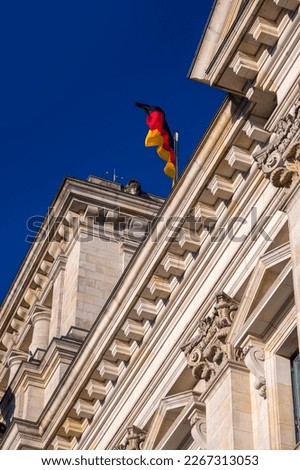 Exterior view of the Reichstag, a historic building in Berlin which houses the Bundestag, the lower house of Germany's parliament.  Royalty-Free Stock Photo #2267313053